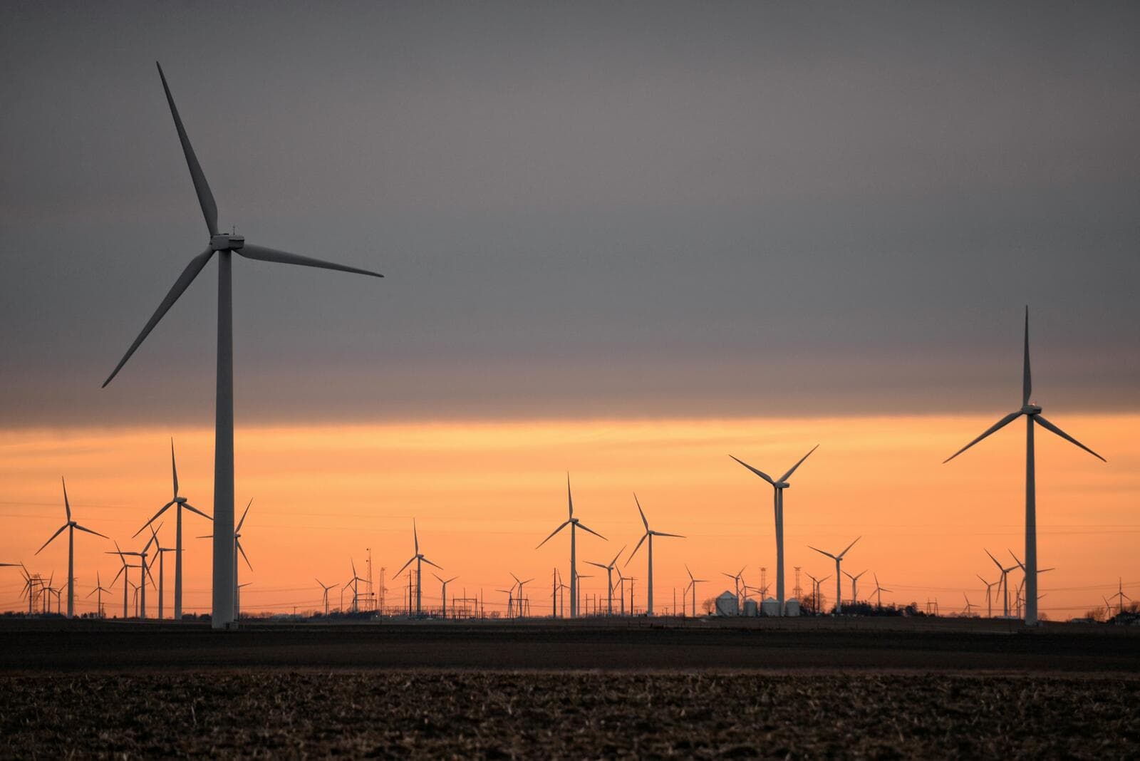 Wind turbines on an Illinois farm at sunset